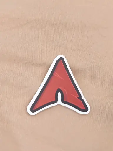A sticker of a red version of the Arch Linux log